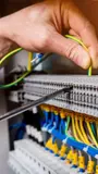 hand working on wires